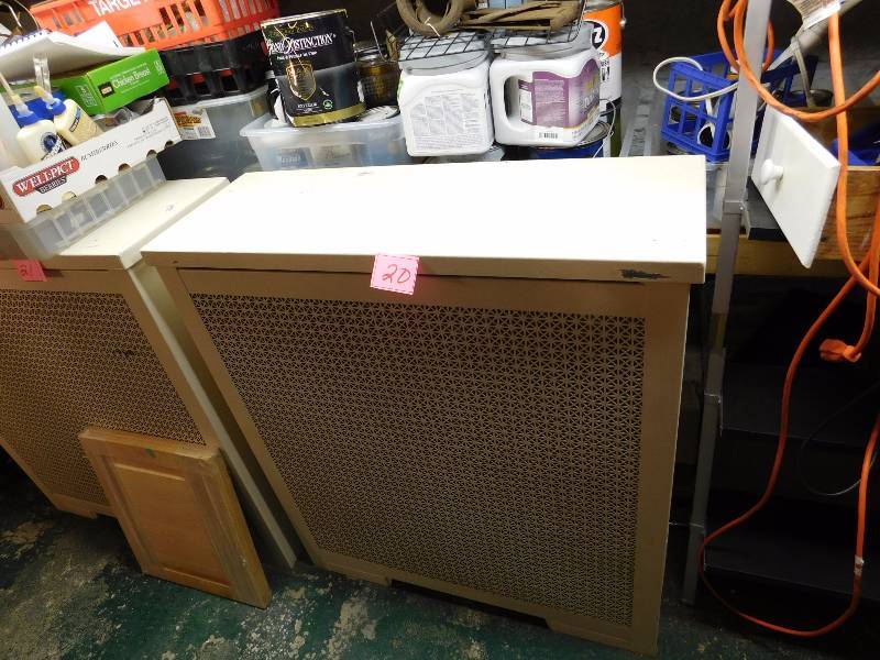 large white radiator cover. Lid lifts open and closes for a flat surface.