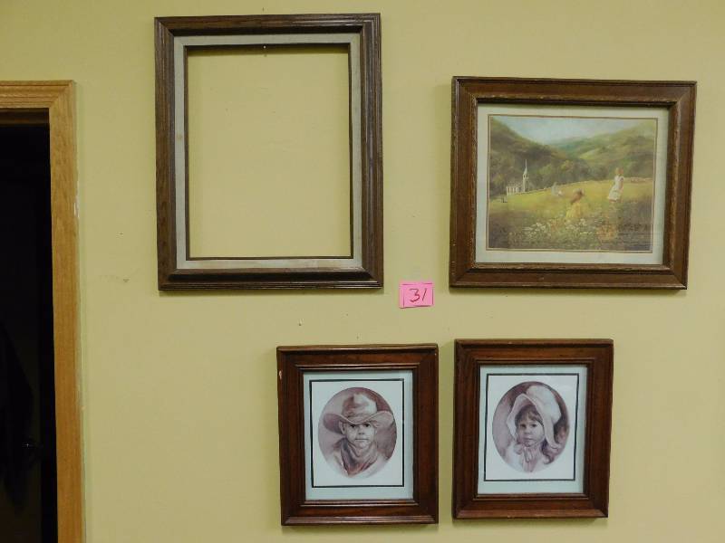 Four wooden frames with country themed artwork.