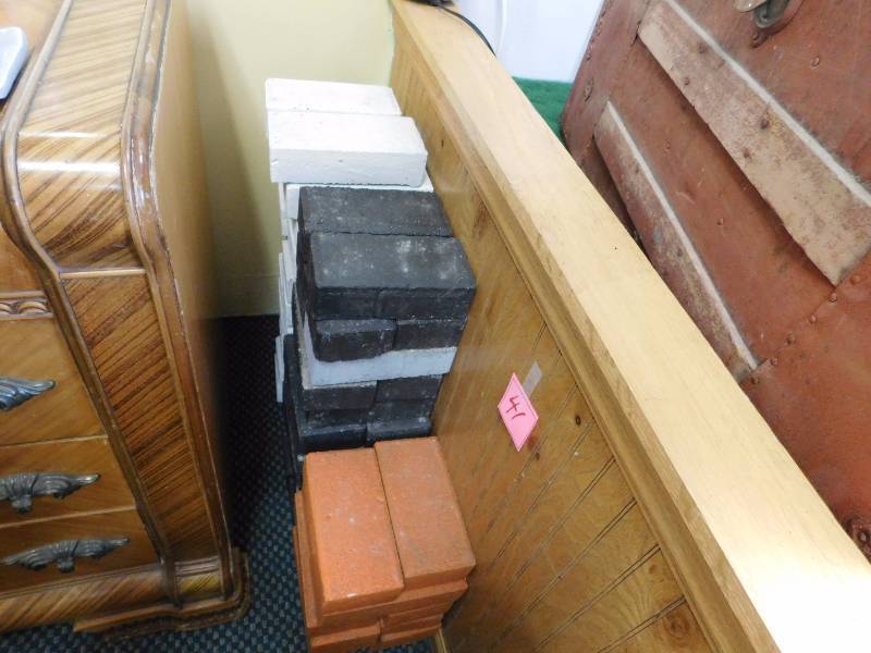 large lot of painted bricks black white and orange