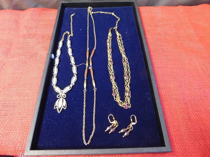 two SARCOV necklaces and one purple and 14 HGE necklace earring set