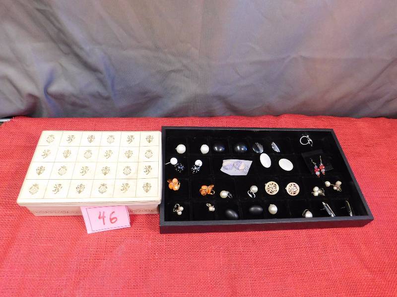 jewelry box filled with jewelry and contents on display tray