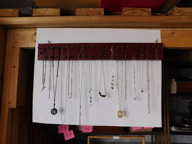large lot of costume jewelry necklaces...FYI... the display is NOT included
