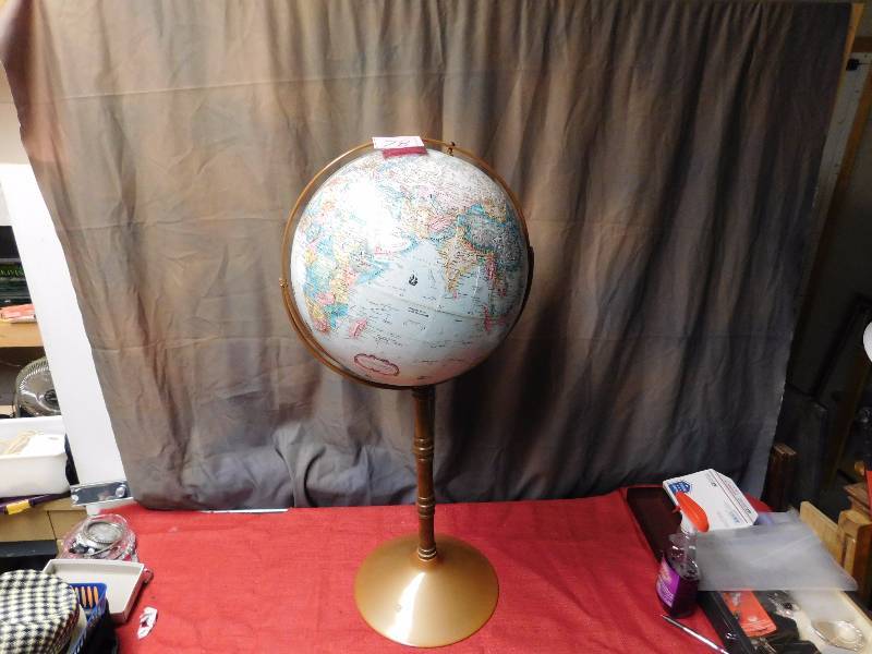 vintage globe on tall stand see photos for better look