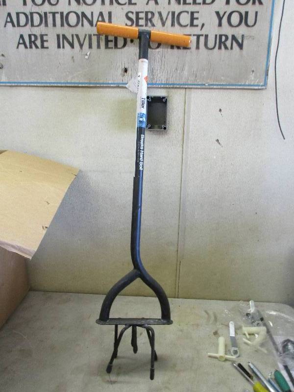 Handheld tiller