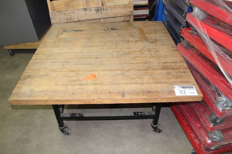 lot 52 image: Table wWooden Top, Metal Base & Wheels 48.5 x 48 x 24.5.