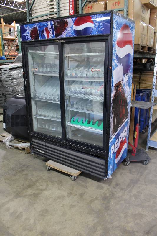 lot 120 image: Pepsi Display Cooler wDual Front Sliding Glass Doors & Pop Display Inserts 54.5 x 29 x 78 Tested & Operational.  Pepsi Approved to Sell.