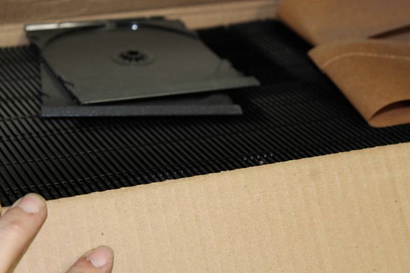 lot 165 image: Tote Lot of Plastic DVDCDGame Cases. Buyer Is Not Required To Take All Cases.