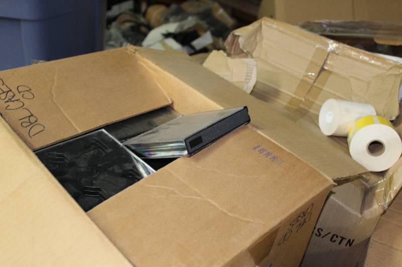 lot 163 image: Tote Lot of Plastic DVDCDGame Cases. Buyer Is Not Required To Take All Cases.
