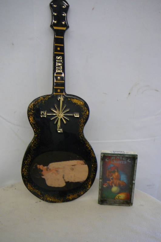 lot 34 image: Elvis Clock and Camels Ash Tray