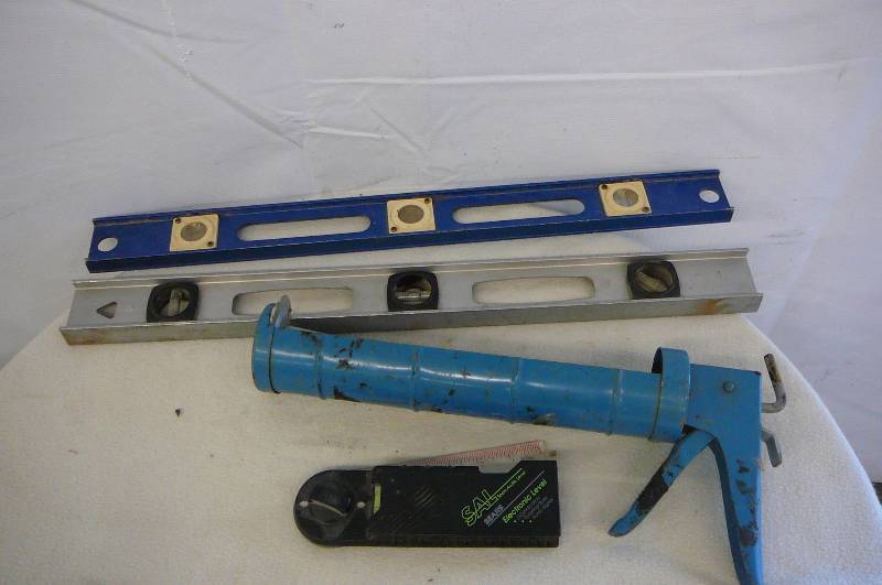 lot 25 image: Lot of Tools levels Caulking gun Electronic Level