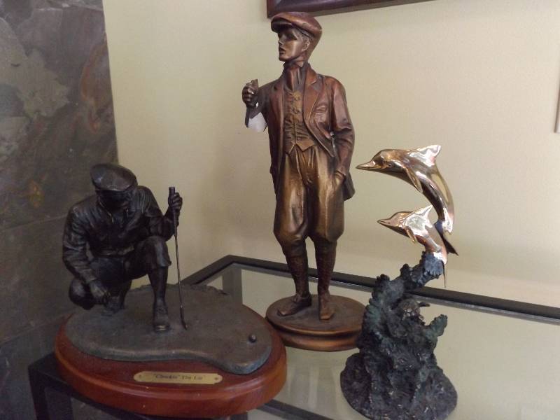 lot 17 image: Golf and Dolphin Statues