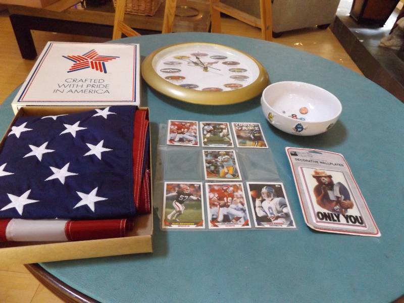 lot 44 image: Racecar Clock, Football Cards, Flag, M & Ms Dish