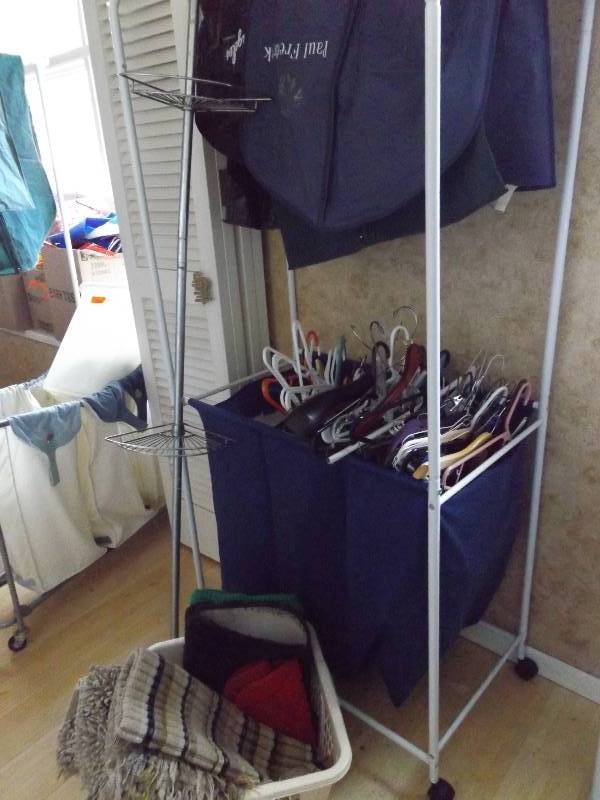 lot 405 image: Rolling hamper, Cleaning Supplies, Shower Rack, Basket, Rugs