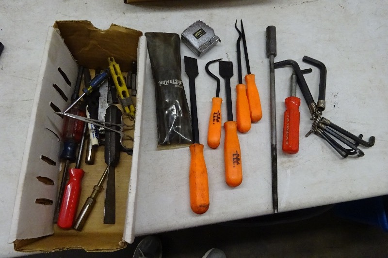 Variety of picks, scrapers, screwdrivers, allen wrenches, tape measure