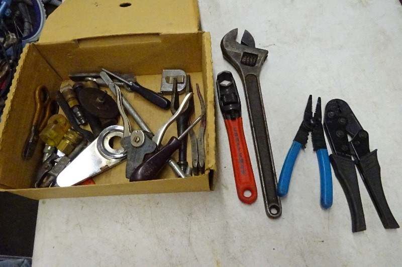 Wire strippers, cresant wrench, screwdriver, battery cable spreader, tape measure