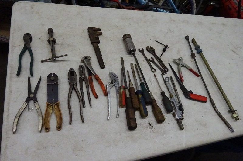 Screwdrivers, side cutters, battery post cleaner, crescent wrench, wire stripper, wrenches and more