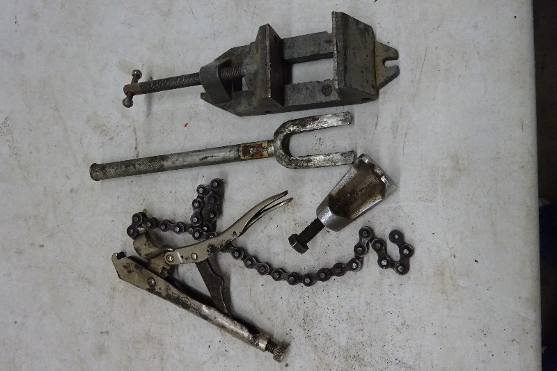 Vise, bearing puller, vise grip chain wrench, ball joint puller