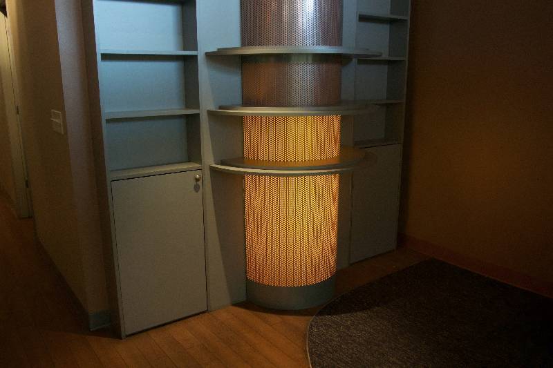 lot 21 image: Tanning Display Case with Multiple Shelves and Light-Up Center Column