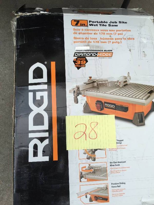 lot 28 image: Ridgid 7 Portable wet Tile Saw