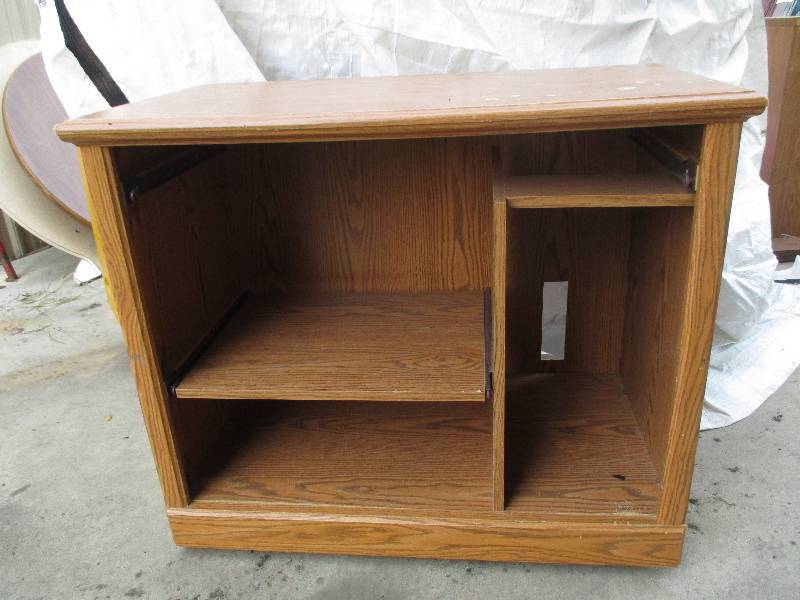 lot 16 image: large TV stand with shelves underne...