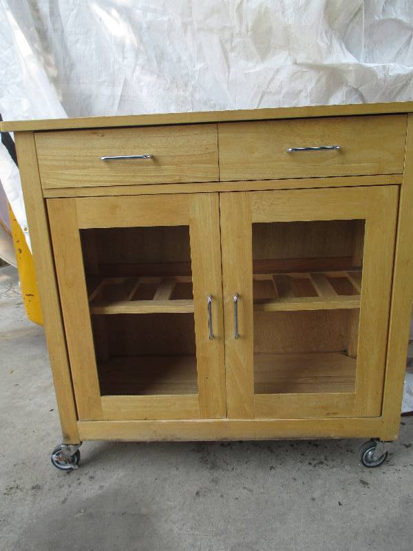 lot 18 image: wooden shelf on wheels with drawers...
