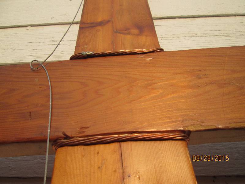 lot 150 image: Large wood cross with copper wire f...
