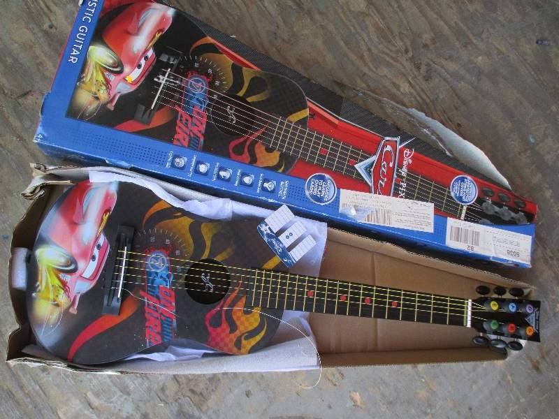 lot 87 image: Disney Cars kids guitar, one broke...