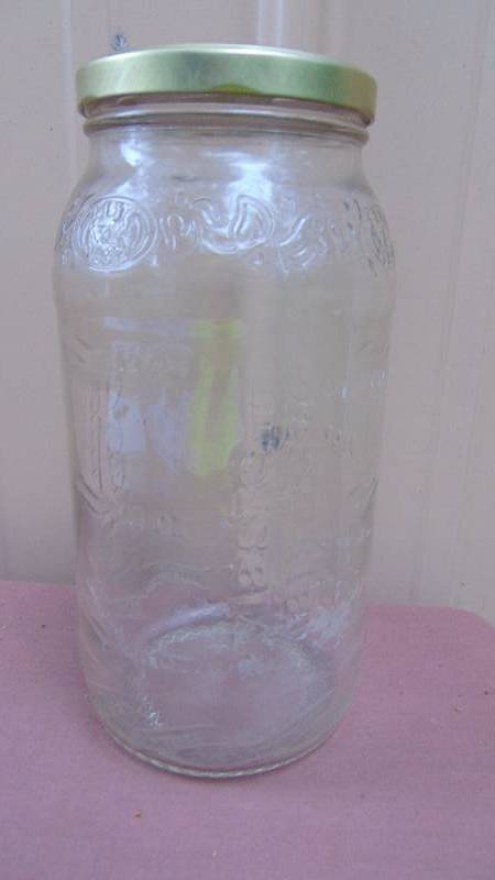 lot 105 image: Large Glass Jar with oz. measurements
