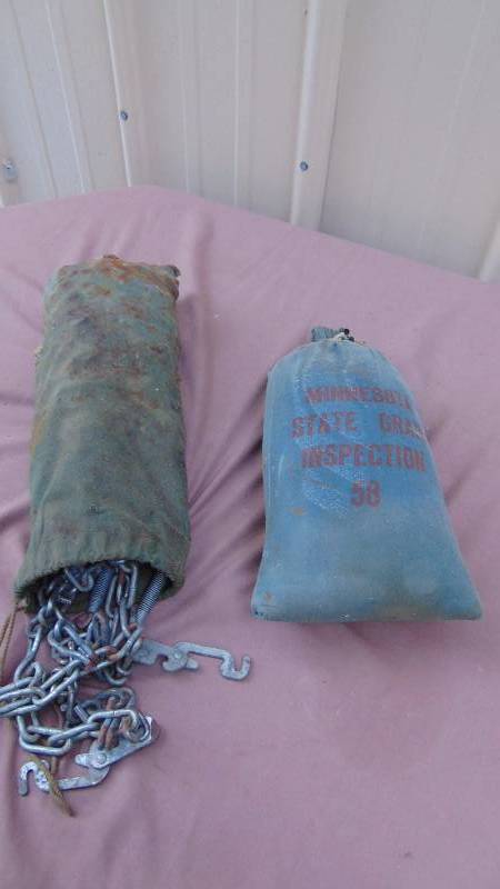 lot 137 image: Vehicle Chains and Sand Bag