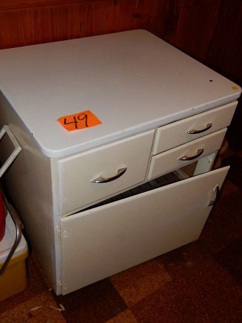 lot 49 image: Metal and enamel cabinet with 3 drawers and lower storage