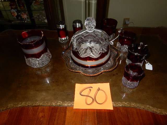 lot 80 image: Cranberry and Cut Glass Butter Dish, Cream and Sugar, Toothpick, other accessories as pictured.