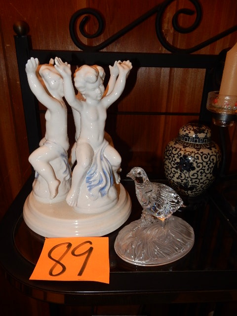 lot 89 image: Holland Mold.. 3 Boys  Crystal Quail, small covered urn (approx 6in tall), Bronze candelabra with glass holders and candles.. Approx 1 ft tall.