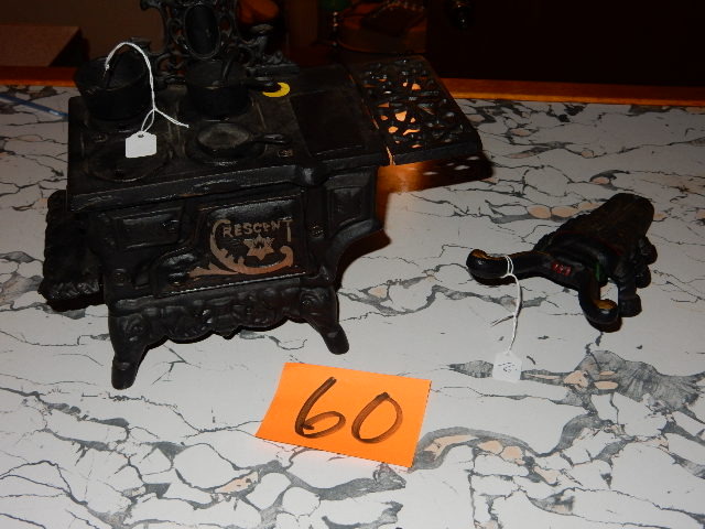 lot 60 image: Cast Iron Old Fashion Woodcook stove and pots and pans.. Cast iron BUG