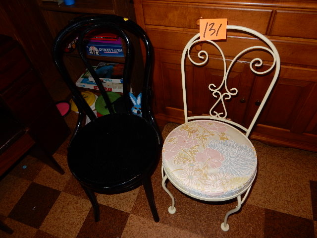 lot 131 image: 2 Vintage Chairs.. 1 Black wood hoop back.. 1, Wrought Iron metal with seat pad.  Both solid and nice shape.
