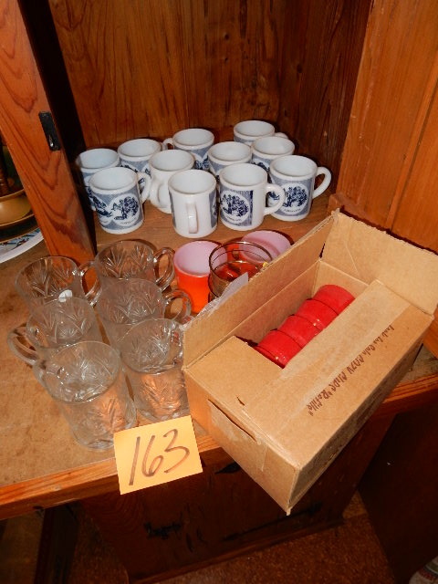 lot 163 image: 11 Currier and Ives mugs, 2 Fire King Mugs, 12 Cozy Cup holders, 6  nice cut glass mugs.