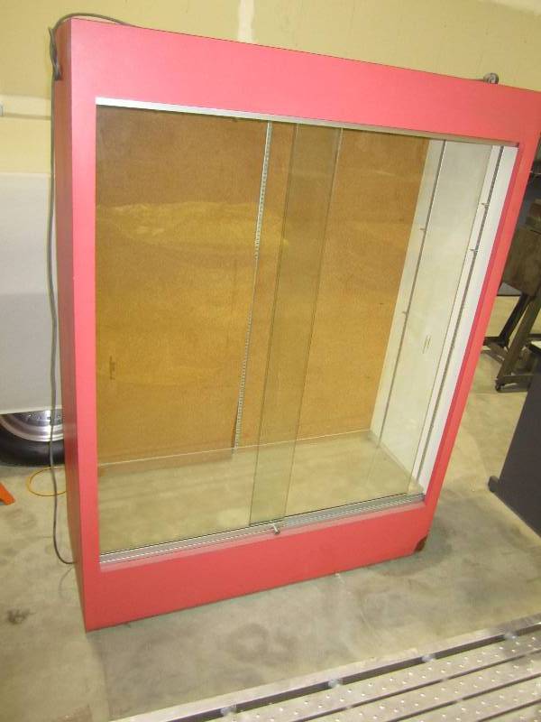 lot 115 image: lighted showcase with sliding glass...