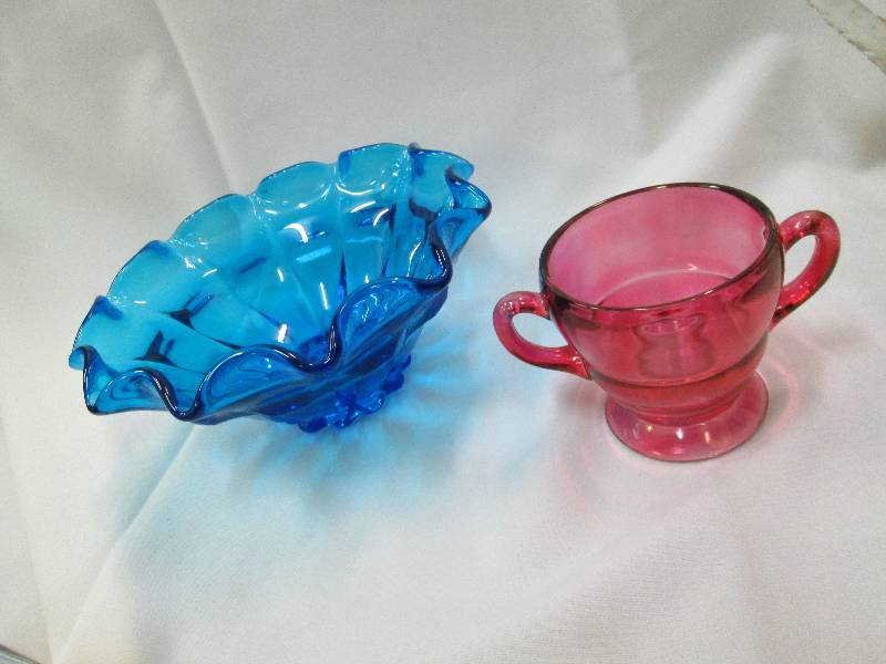 Blue glass bowl and a dark pink ser...