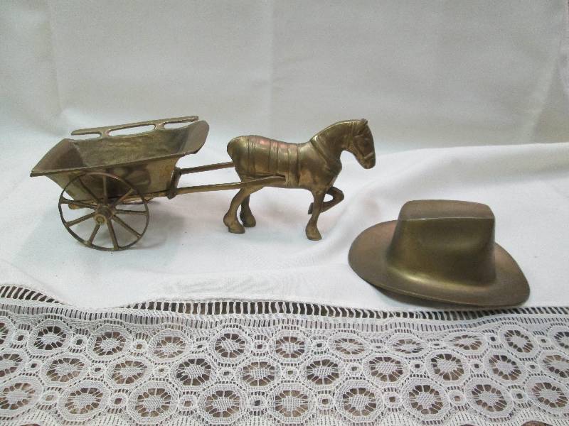 Metal horse and trailer and hat...