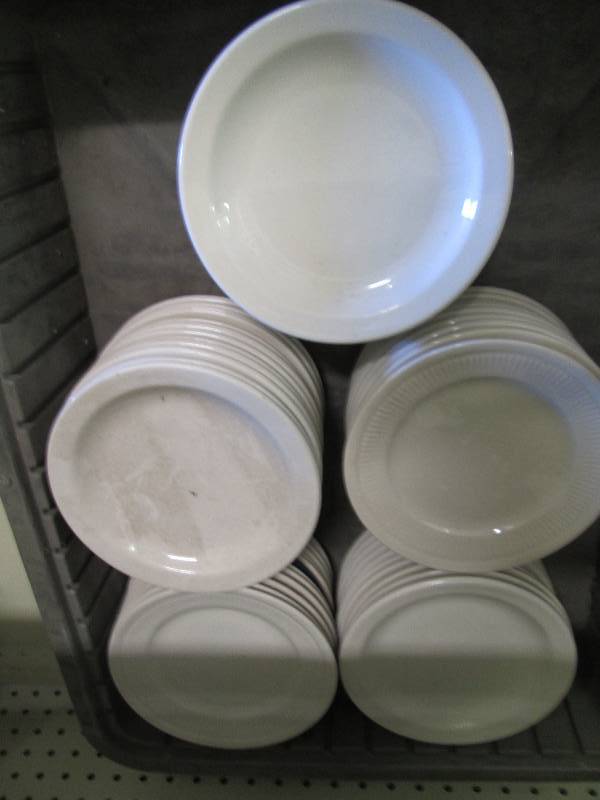 Assortment of small white plates...