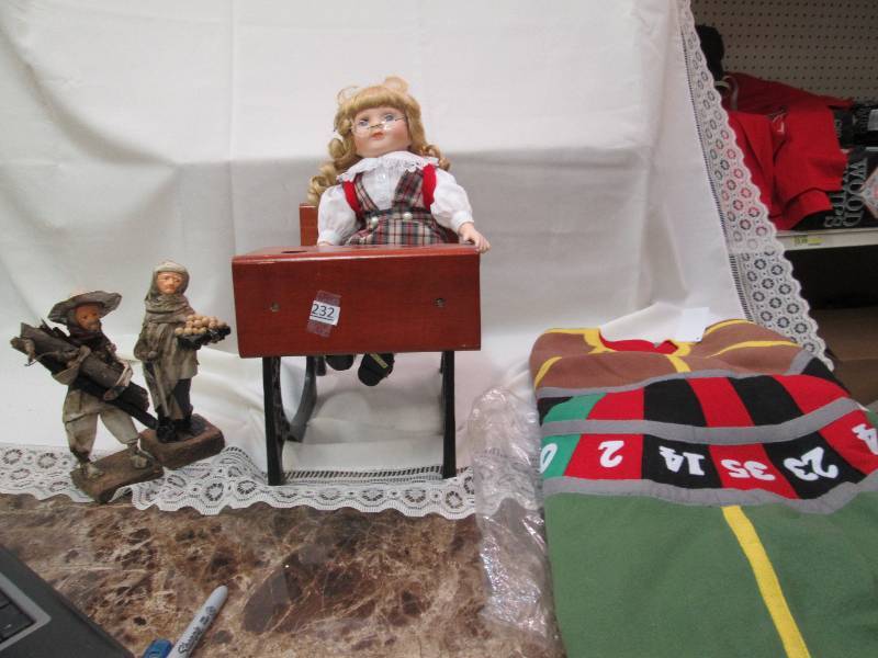 Tree skirt, small desk, doll, two p...