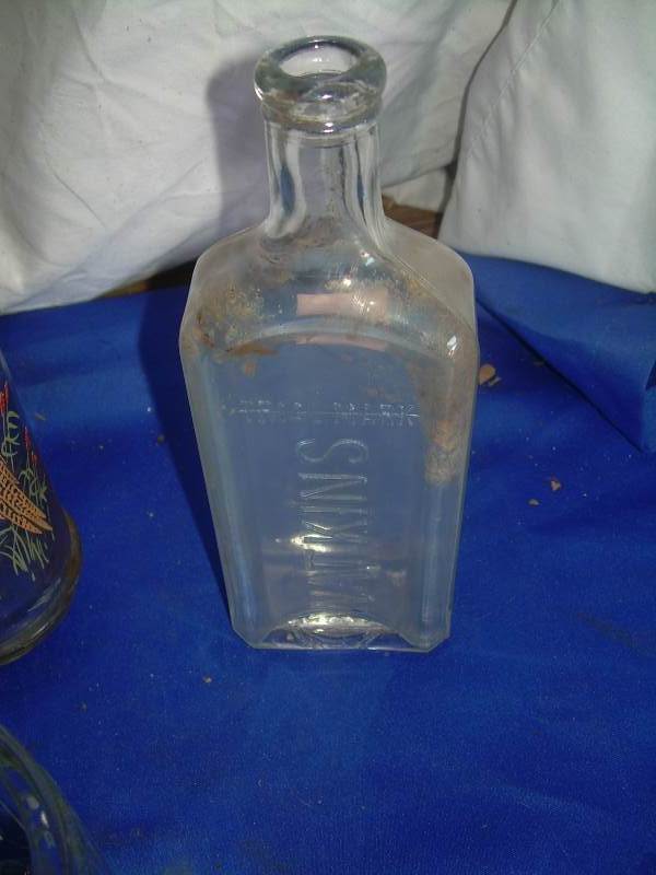 vintage milk bottle and watkins