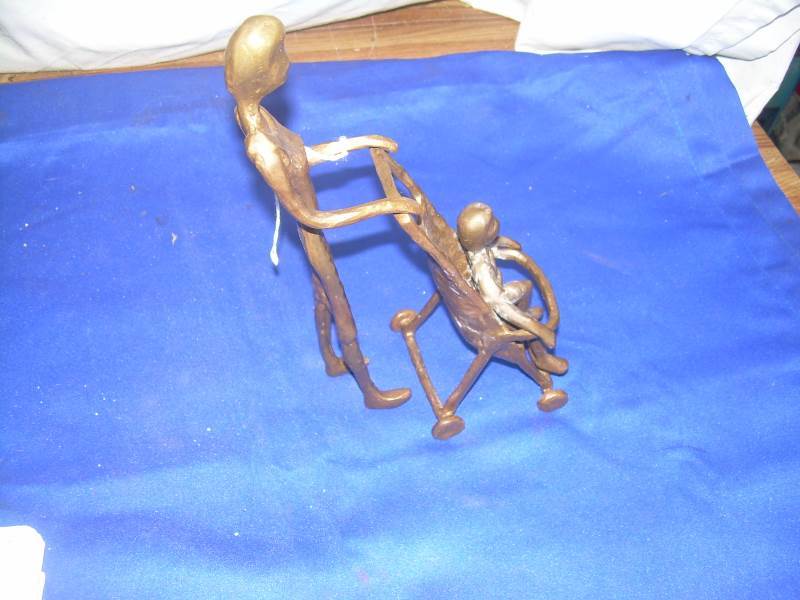 Brass women and child