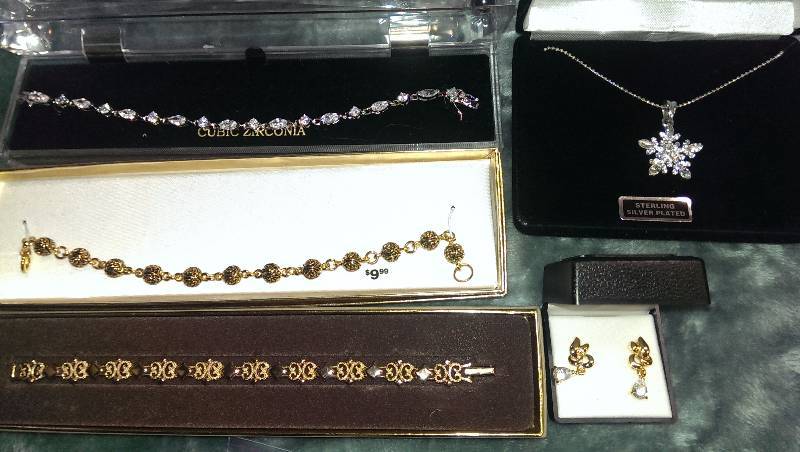 Three bracelets, necklace (sterling silver) , and a pair of earrings.