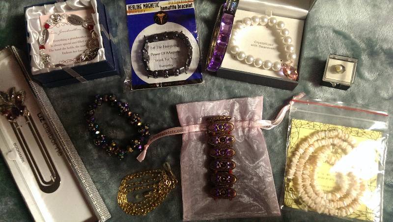 Six bracelets, two eyeglass holders, a tie tack, and a bookmarker.