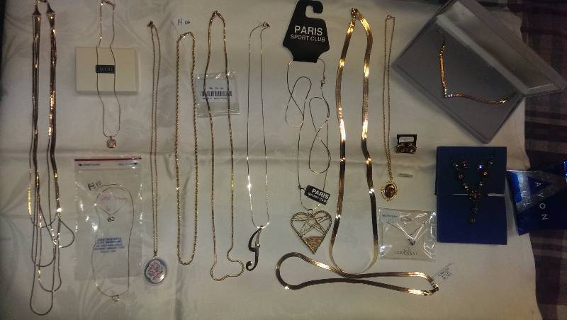 Large variety of necklaces (some 14k gold), and earrings.