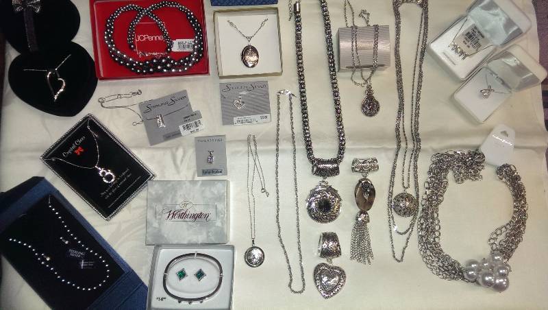 Large variety of necklaces and bracelets (some sterling silver), and earrings.
