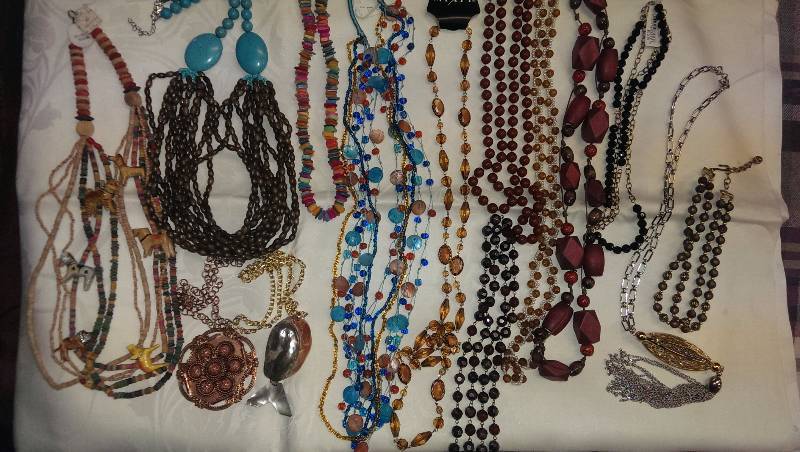 Large variety of beaded necklaces.