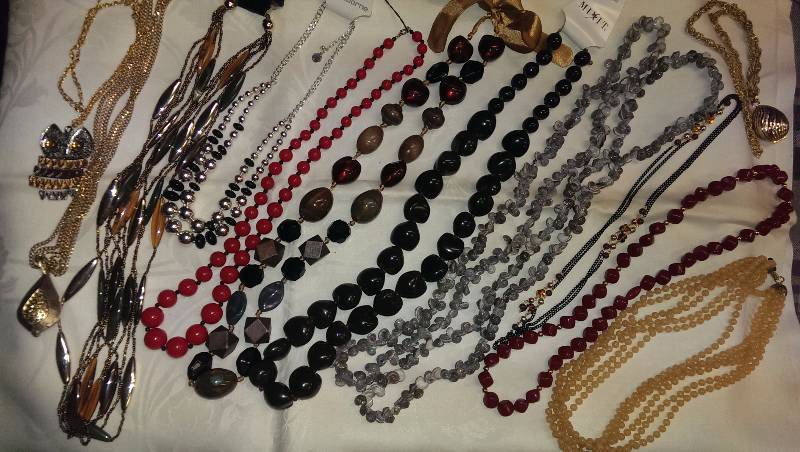 Large variety of beaded necklaces.