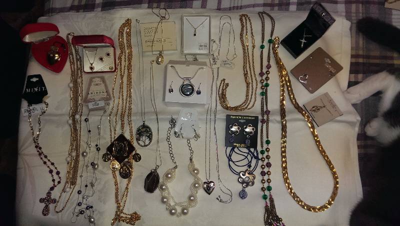 Large variety of necklaces (some sterling silver), and earrings.