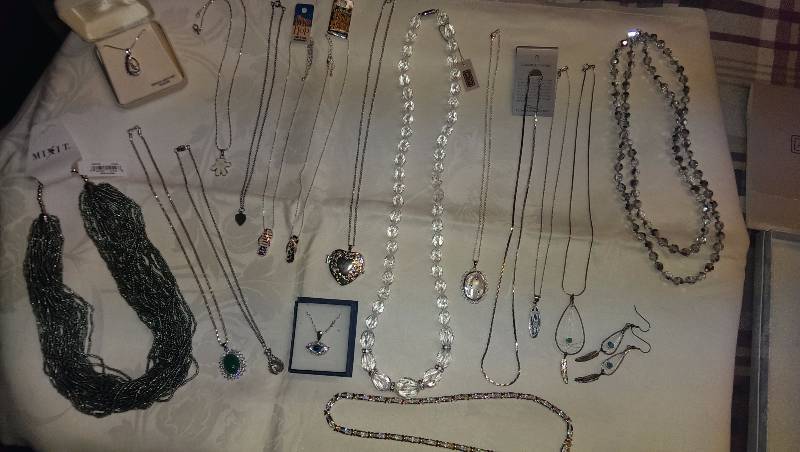 Large variety of necklaces (some sterling silver), and earrings.